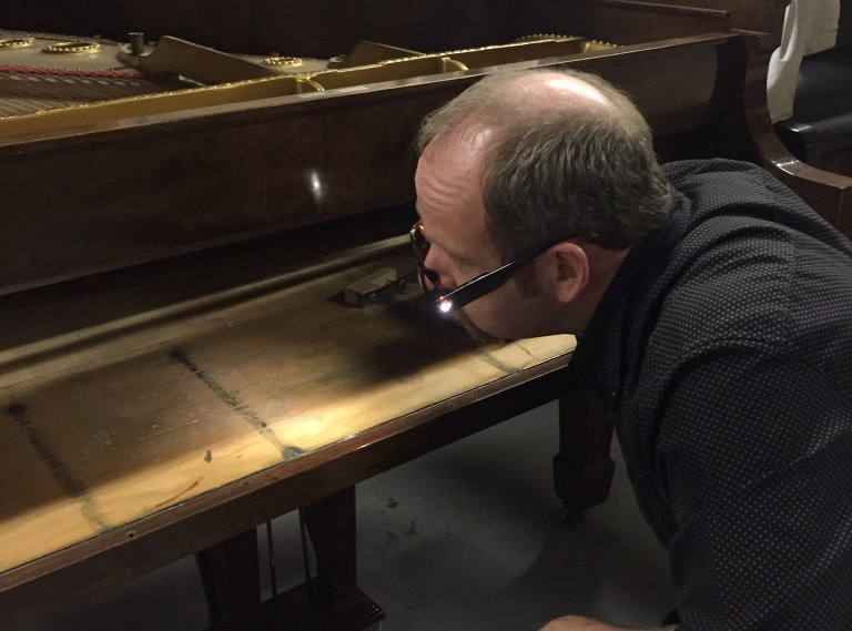 examining a piano