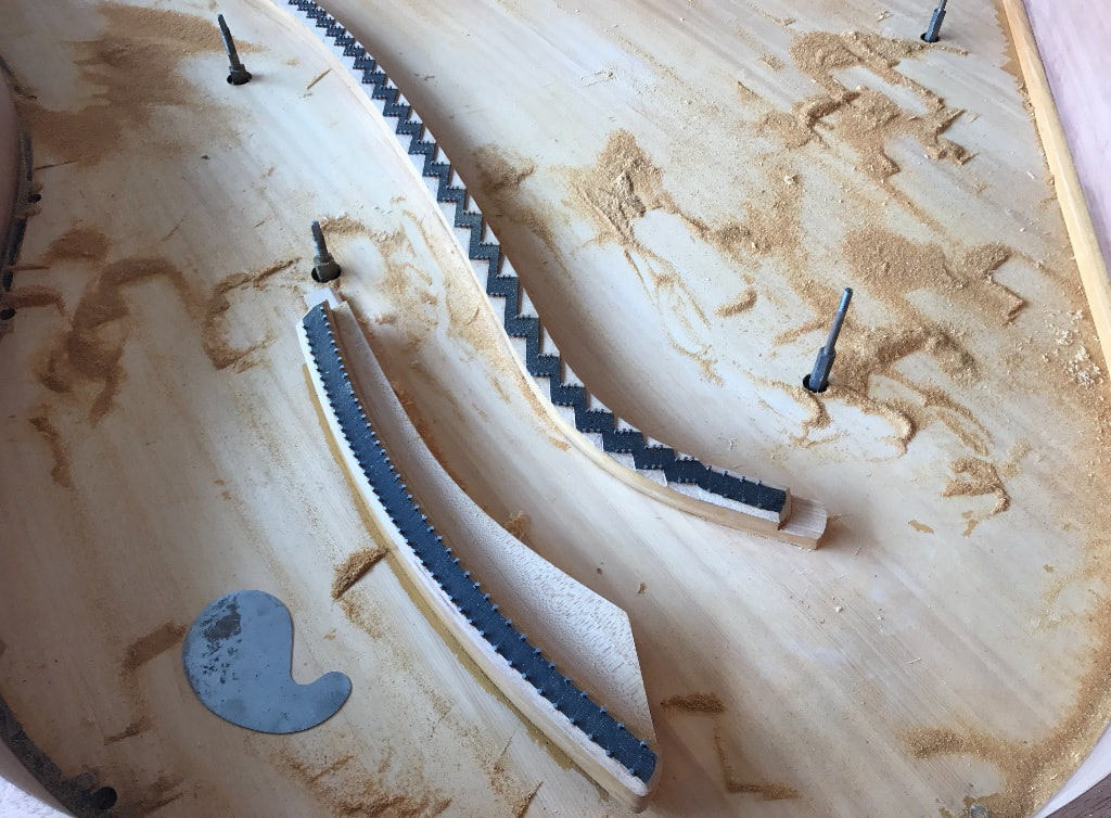 scraping a piano soundboard